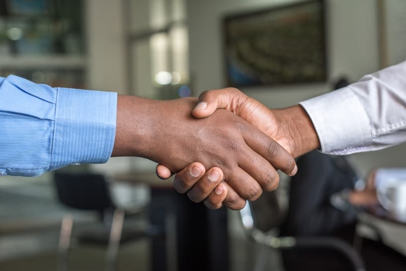 Employer and candidate shaking hands